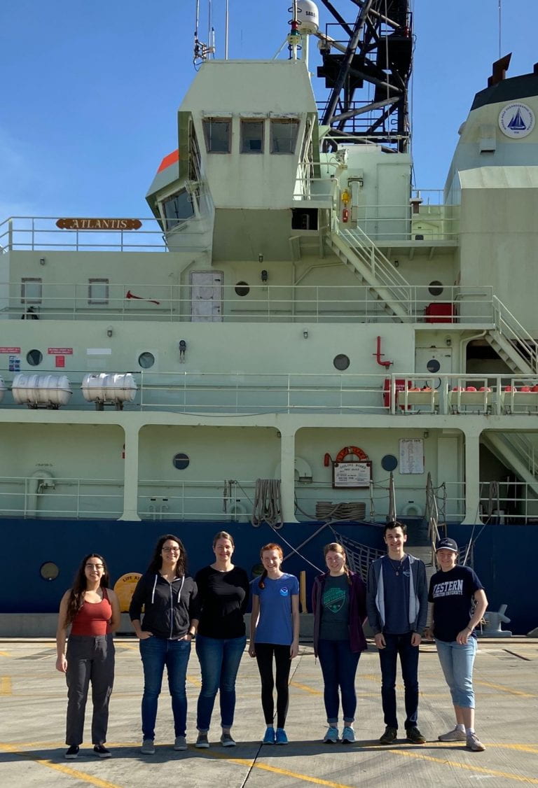 Arellano Lab standing in front of the R/V Atlantis