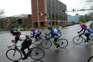 Multiple riders turning through an intersection during a race