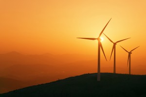 wind turbines silhouette on mountain at the sunset