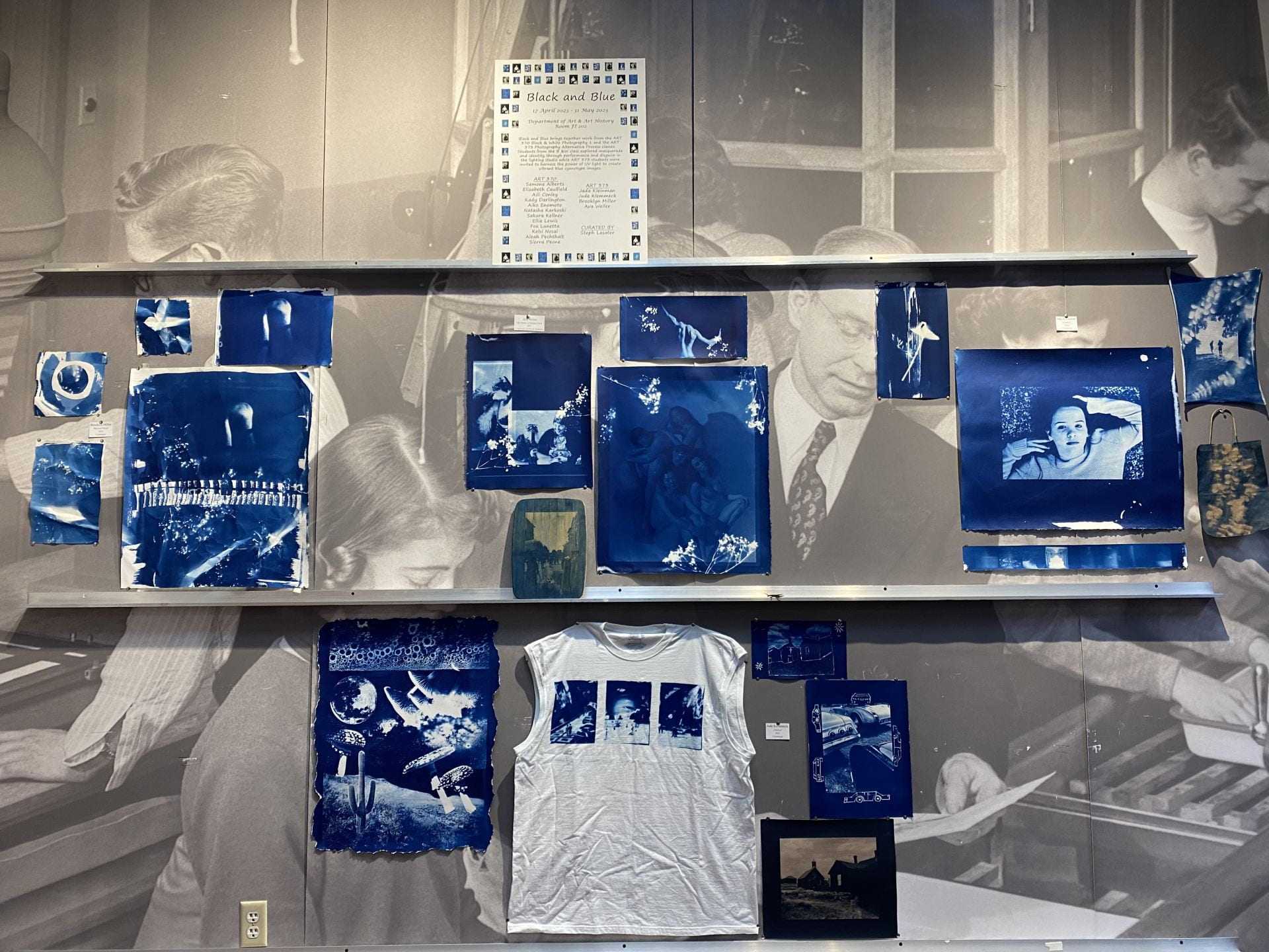 Several cyanotype pieces on display, a large white t-shirt with cyanotype prints takes center stage