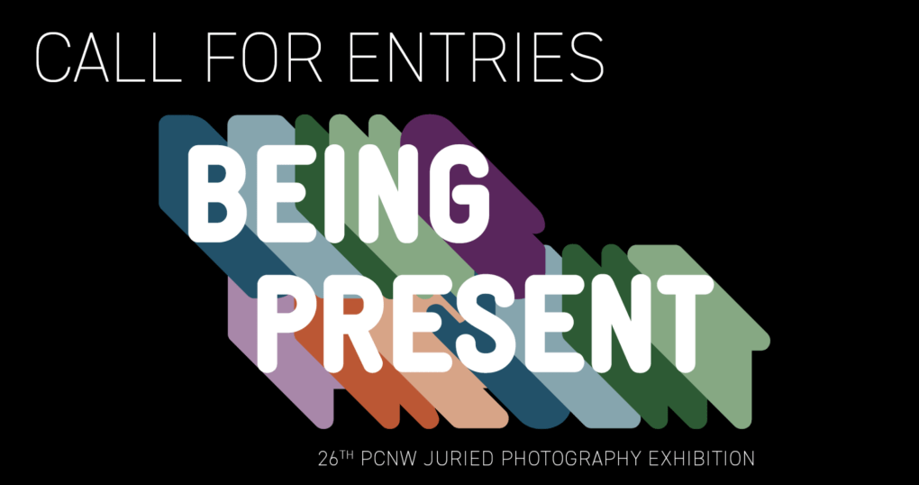 A poster reads "Call for Entries, BEING PRESENT, 26th PCNW Juried Photography Exhibition"