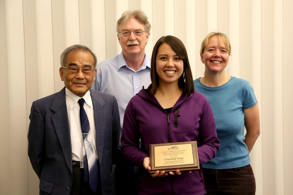 Four scholarship awardees including Courtney Fung bottom right, lady in blue in top right, large white male in top left corner and diminutive asian male in sharp blue blazer bottom left.