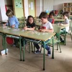 Children play a game at school desks