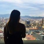 A student looks over the city of Barcelona