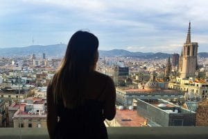 A student looks over the city of Barcelona