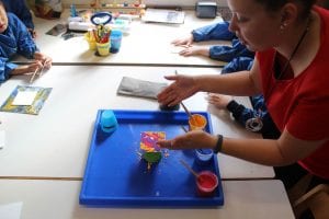 Children create abstract paintings