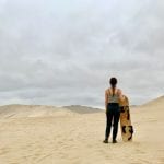 Student faces a desert landscape