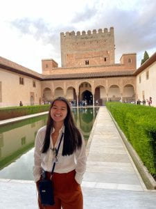 Anna Sutherland standing in front of the Alhambra in Granada, Spain