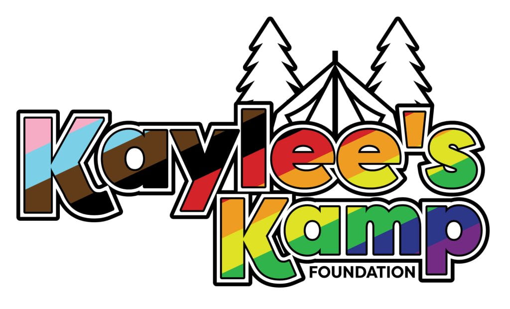 Kaylee's Kamp Foundation logo in progress pride rainbow colors and fir trees and tent outline in the background