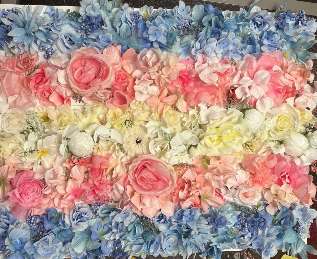 photo of the trans flag made of flowers