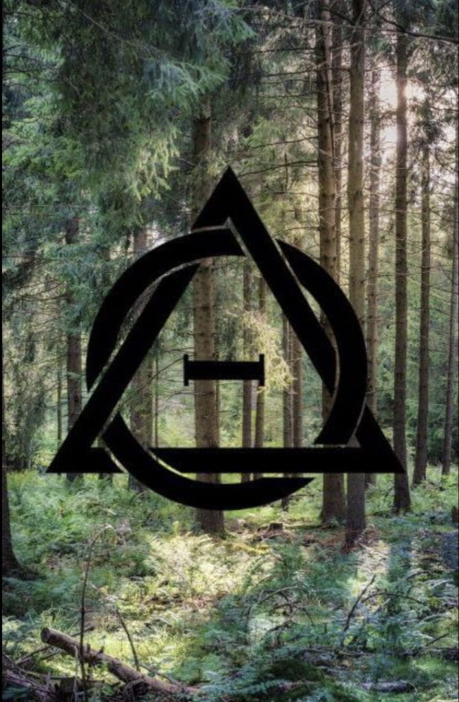 A forest background with a stylized interlocking triangle and theta symbol.